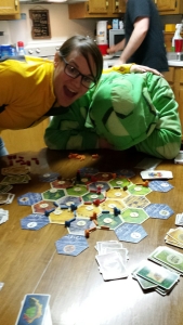 Brandy Bartle demonstrates how good it feels to beat your spouse at Settlers of Catan.